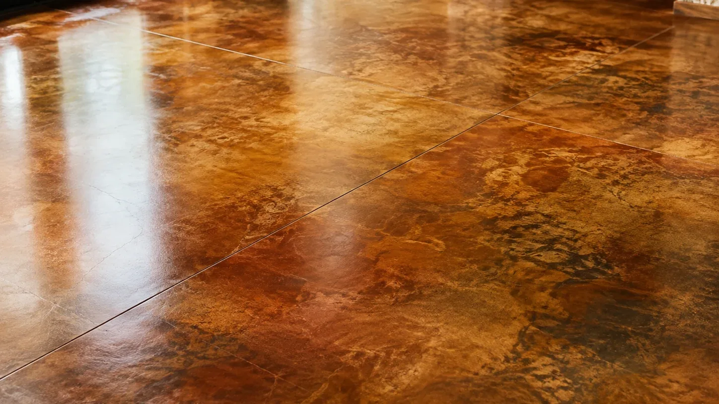 Mottled amber acid-stained concrete floor, wide angle